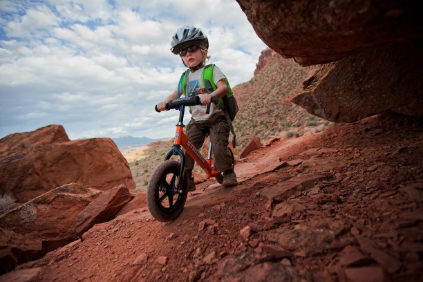 Toddler Riding Strider on Pipe Dream Trail, Utah